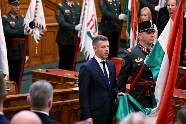 Hungary's incoming Prime Minister Peter Magyar is sworn in at the Hungarian parliament in Budapest on May 9, 2026. Lawmakers in Hungary on May 9, 2026 swore in pro-European conservative Peter Magyar as the country's new prime minister, after elections last month that ended Viktor Orban's 16 years in power. The parliament formally elected Magyar with 140 votes for, 54 against, and one abstention in the inaugural session of the new chamber resulting from the April polls. (Photo by Attila KISBENEDEK / AFP)
