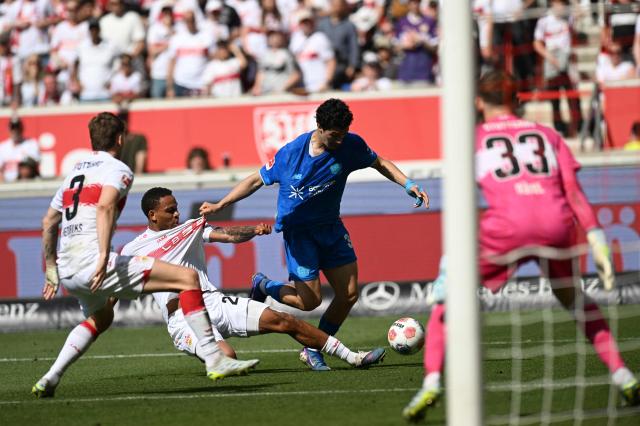 (L-R) Stuttgart's Dutch defender #03 Ramon Hendriks, Stuttgart's Danish midfielder #28 Nikolas Nartey, Bayer Leverkusen's Algerian midfielder #30 Ibrahim Maza and Stuttgart's German goalkeeper #33 Alexander Nuebel vie for the ball during the German first division Bundesliga football match between VfB Stuttgart and Bayer 04 Leverkusen in Stuttgart, southwestern Germany on May 9, 2026. (Photo by THOMAS KIENZLE / AFP) / DFL REGULATIONS PROHIBIT ANY USE OF PHOTOGRAPHS AS IMAGE SEQUENCES AND/OR QUASI-VIDEO