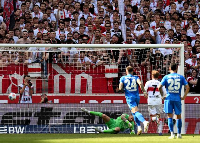 Stuttgart's German defender #07 Maximilian Mittelstaedt (2nd R) shoots the ball from the penalty spot and scores the 2-1 goal against Bayer Leverkusen's Dutch goalkeeper #01 Mark Flekken (L) during the German first division Bundesliga football match between VfB Stuttgart and Bayer 04 Leverkusen in Stuttgart, southwestern Germany on May 9, 2026. (Photo by THOMAS KIENZLE / AFP) / DFL REGULATIONS PROHIBIT ANY USE OF PHOTOGRAPHS AS IMAGE SEQUENCES AND/OR QUASI-VIDEO