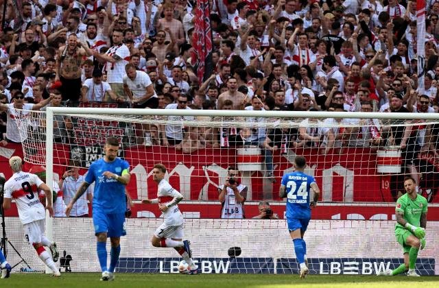 Stuttgart's German defender #07 Maximilian Mittelstaedt (3rd L) celebrates after scoring the 2-1 goal from the penalty spot against Bayer Leverkusen's Dutch goalkeeper #01 Mark Flekken (R) during the German first division Bundesliga football match between VfB Stuttgart and Bayer 04 Leverkusen in Stuttgart, southwestern Germany on May 9, 2026. (Photo by THOMAS KIENZLE / AFP) / DFL REGULATIONS PROHIBIT ANY USE OF PHOTOGRAPHS AS IMAGE SEQUENCES AND/OR QUASI-VIDEO