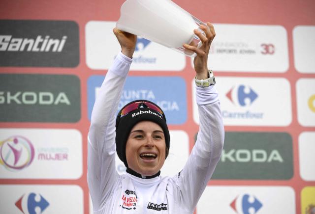 Third placed of 2026 La Vuelta Femenina cycling tour of Spain, team Team Visma - Lease a Bike's French rider Marion Bunel celebrates on the podium after the 7th stage, a 132.9 km race between Pola de Laviana and Alto de l'Angliru, on May 9, 2026. (Photo by Miguel RIOPA / AFP)