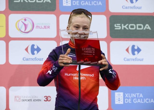 Stage winner team HPH's Swiss rider Petra Stiasny celebrates on the podium after the 7th stage of the 2026 La Vuelta Femenina cycling tour of Spain, a 132.9 km race between Pola de Laviana and Alto de l'Angliru, on May 9, 2026. (Photo by Miguel RIOPA / AFP)