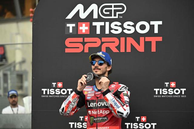 Ducati Lenovo Team's Italian rider Francesco Bagnaia celebrates on the podium after finishing second in the Moto GP Grand Prix of France Sprint race at Le Mans, northwestern France, on May 9, 2026. (Photo by Loic VENANCE / AFP)