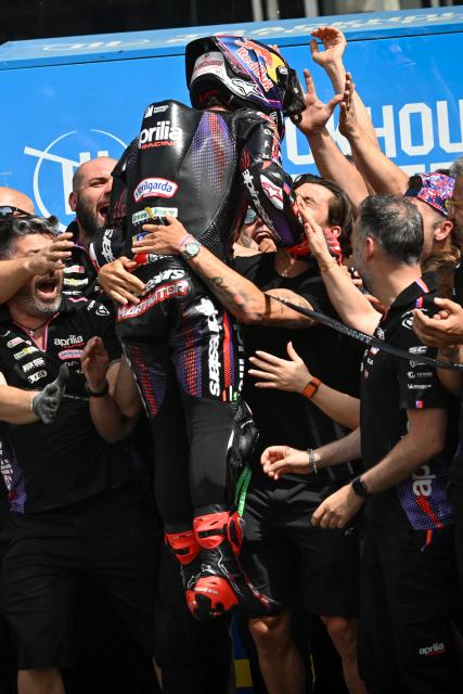Aprilia Racing's Spanish rider Jorge Martin celebrates with his team after winning the Moto GP Grand Prix of France Sprint race at Le Mans, northwestern France, on May 9, 2026. (Photo by Loic VENANCE / AFP)