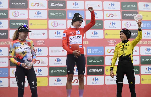 Winner of 2026 La Vuelta Femenina cycling tour of Spain, team UAE ADQ's Spanish rider Paula Blasi Cairol, second placed team SD Worx - Protime's Dutch rider Anna van der Breggen (L) and third placed Team Visma - Lease a Bike's French rider Marion Bunel (R) celebrate on the podium after the 7th stage, a 132.9 km race between Pola de Laviana and Alto de l'Angliru, on May 9, 2026. (Photo by Miguel RIOPA / AFP)