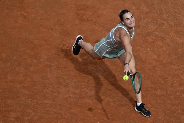 TOPSHOT - Belarus' Aryna Sabalenka hits a return to Romania's Sorana Cirstea during the WTA Rome Open tennis tournament at Foro Italico in Rome on May 9, 2026. (Photo by Tiziana FABI / AFP)