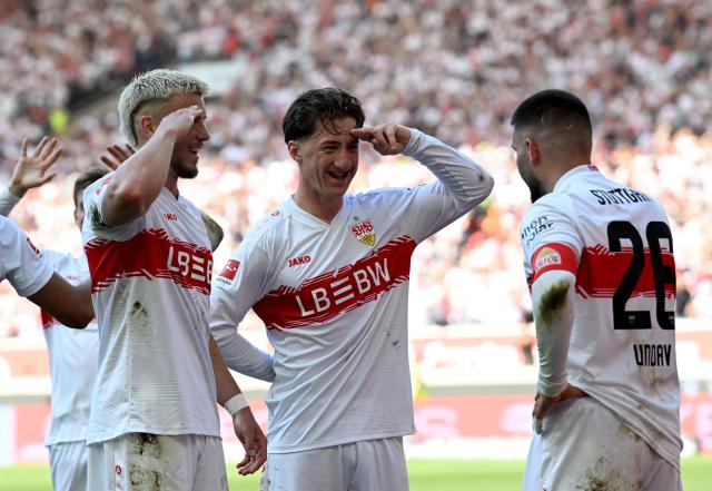 Stuttgart's German forward #26 Deniz Undav (R) celebrates with Stuttgart's Bosnian forward #09 Ermedin Demirovic (L) and Stuttgart's German midfielder #06 Angelo Stiller (C) after scoring the 3-1 goal during the German first division Bundesliga football match between VfB Stuttgart and Bayer 04 Leverkusen in Stuttgart, southwestern Germany on May 9, 2026. (Photo by THOMAS KIENZLE / AFP) / DFL REGULATIONS PROHIBIT ANY USE OF PHOTOGRAPHS AS IMAGE SEQUENCES AND/OR QUASI-VIDEO