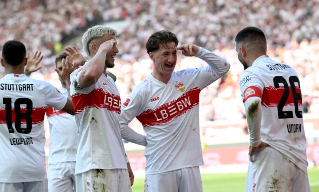 Stuttgart's German forward #26 Deniz Undav (R) celebrates with Stuttgart's Bosnian forward #09 Ermedin Demirovic (L) and Stuttgart's German midfielder #06 Angelo Stiller (C) after scoring the 3-1 goal during the German first division Bundesliga football match between VfB Stuttgart and Bayer 04 Leverkusen in Stuttgart, southwestern Germany on May 9, 2026. (Photo by THOMAS KIENZLE / AFP) / DFL REGULATIONS PROHIBIT ANY USE OF PHOTOGRAPHS AS IMAGE SEQUENCES AND/OR QUASI-VIDEO