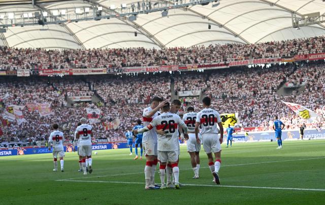 Stuttgart's German forward #26 Deniz Undav (C) celebrates with teammates after scoring the 3-1 goal during the German first division Bundesliga football match between VfB Stuttgart and Bayer 04 Leverkusen in Stuttgart, southwestern Germany on May 9, 2026. (Photo by THOMAS KIENZLE / AFP) / DFL REGULATIONS PROHIBIT ANY USE OF PHOTOGRAPHS AS IMAGE SEQUENCES AND/OR QUASI-VIDEO