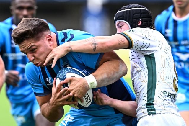 Montpellier’s Argentinian centre Justo Piccardo (L) breaks away with the ball from Montauban's French scrum-half Mael Castel prior to score a try during the French Top 14 rugby union match between Montpellier Herault Rugby and US Montauban at the Septeo Stadium in Montpellier, southern France on May 9, 2026. (Photo by Gabriel BOUYS / AFP)