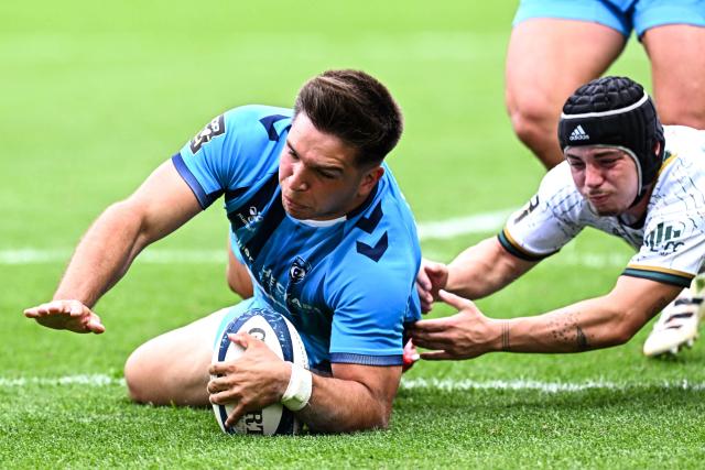 Montpellier’s Argentinian centre Justo Piccardo (L) dives across the line to score a try during the French Top 14 rugby union match between Montpellier Herault Rugby and US Montauban at the Septeo Stadium in Montpellier, southern France on May 9, 2026. (Photo by Gabriel BOUYS / AFP)