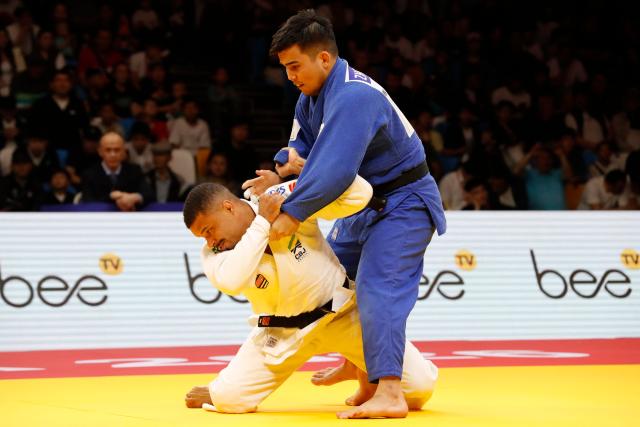 Brazil's David Lima (white) and Kazakhstan's Doskhan Zholzhaxynov compete in the men's under 81 kg bronze medal bout at the Astana Grand Slam judo tournament in Astana on May 9, 2026. (Photo by STANISLAV FILIPPOV / AFP)
