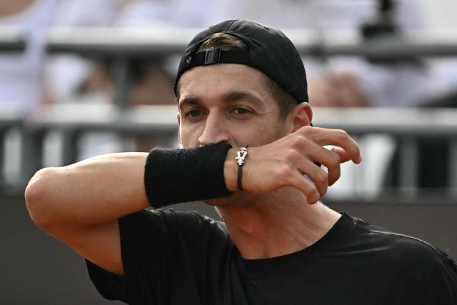 French Terence Atman reacts during his match against Italy's Flavio Cobolli during the ATP Rome Open tennis tournament at Foro Italico in Rome on May 9, 2026. (Photo by Filippo MONTEFORTE / AFP)