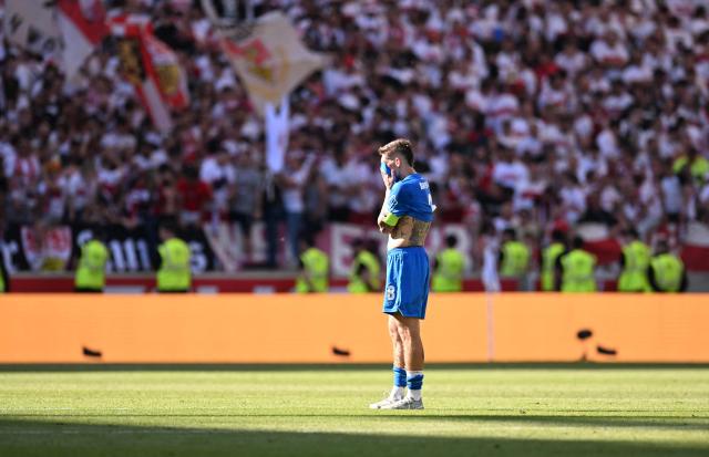 Bayer Leverkusen's German midfielder #08 Robert Andrich stands on the pitch after the German first division Bundesliga football match between VfB Stuttgart and Bayer 04 Leverkusen in Stuttgart, southwestern Germany on May 9, 2026. (Photo by THOMAS KIENZLE / AFP) / DFL REGULATIONS PROHIBIT ANY USE OF PHOTOGRAPHS AS IMAGE SEQUENCES AND/OR QUASI-VIDEO