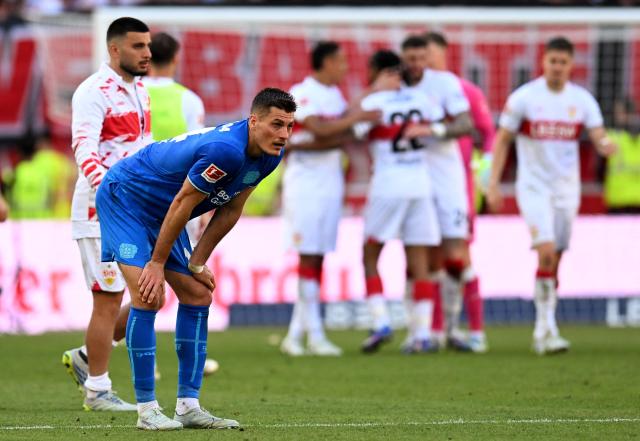 Bayer Leverkusen's Czech forward #14 Patrik Schick (L) stands on the pitch after the German first division Bundesliga football match between VfB Stuttgart and Bayer 04 Leverkusen in Stuttgart, southwestern Germany on May 9, 2026. (Photo by THOMAS KIENZLE / AFP) / DFL REGULATIONS PROHIBIT ANY USE OF PHOTOGRAPHS AS IMAGE SEQUENCES AND/OR QUASI-VIDEO