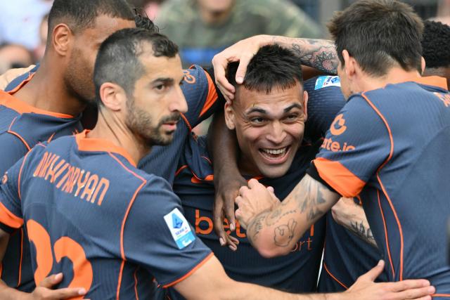 Inter Milan's Argentine forward #10 Lautaro Martinez (C) celebrates with teammates after scoring his team's first goal during the Italian Serie A football match between Lazio and InterMilan at the Olympic stadium in Rome on May 9, 2026. (Photo by Alberto PIZZOLI / AFP)