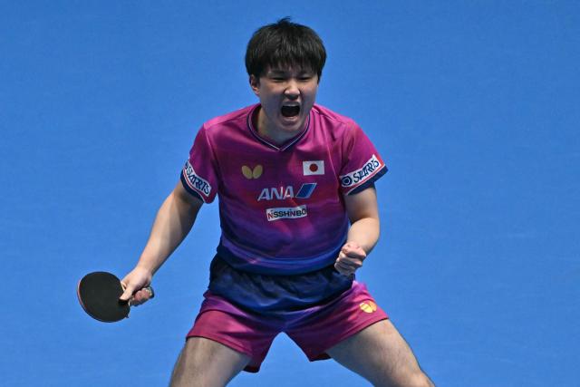 Japan's Tomokazu Harimoto reacts while playing against Taiwan's Lin Yun-ju during their Men's Teams semi-final match at the ITTF World Table Tennis Championships in Wembley Arena, west London on May 9, 2026. (Photo by Glyn KIRK / AFP)