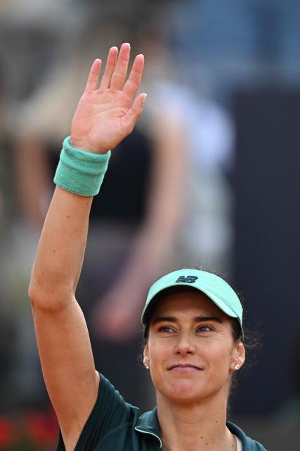 Romania's Sorana Cirstea celebrates after winning against Belarus' Aryna Sabalenka during the WTA Rome Open tennis tournament at Foro Italico in Rome on May 9, 2026. (Photo by Tiziana FABI / AFP)