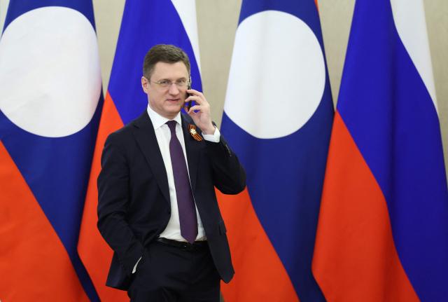 Russia's Deputy Prime Minister Alexander Novak speaks on the phone before a meeting between Russian President and Laotian President at the Kremlin in Moscow on May 9, 2026. (Photo by Ramil Sitdikov / POOL / AFP)