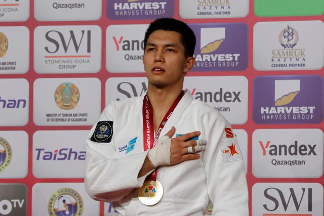 Gold medallist Kazakhstan's Zhalgas Kairolla celebrates during the medal ceremony for the men's under 81 kg event at the Astana Grand Slam judo tournament in Astana on May 9, 2026. (Photo by STANISLAV FILIPPOV / AFP)