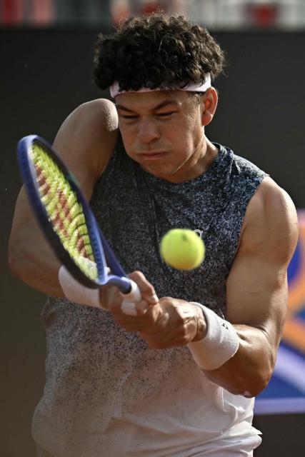 USA's Ben Shelton hits a return to Georgia's Nikoloz Basilashvili during the ATP Rome Open tennis tournament at Foro Italico in Rome on May 9, 2026. (Photo by Filippo MONTEFORTE / AFP)