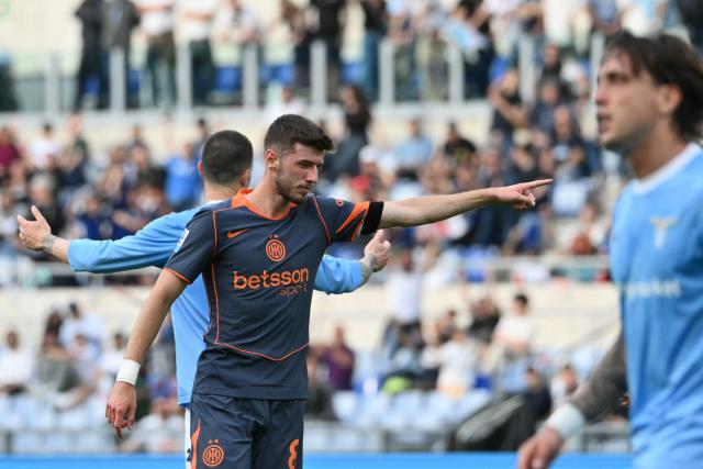 Inter Milan's Croatian midfielder #08 Petar Sucic (L) celebrates after scoring his team's second goal during the Italian Serie A football match between Lazio and InterMilan at the Olympic stadium in Rome on May 9, 2026. (Photo by Alberto PIZZOLI / AFP)