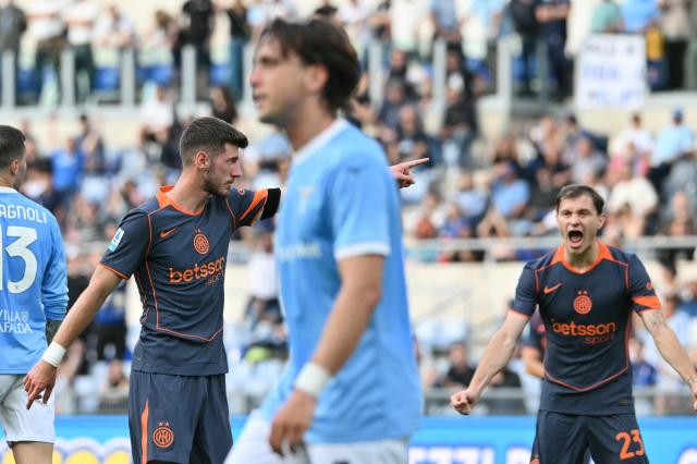 Inter Milan's Croatian midfielder #08 Petar Sucic (L) celebrates after scoring his team's second goal during the Italian Serie A football match between Lazio and InterMilan at the Olympic stadium in Rome on May 9, 2026. (Photo by Alberto PIZZOLI / AFP)