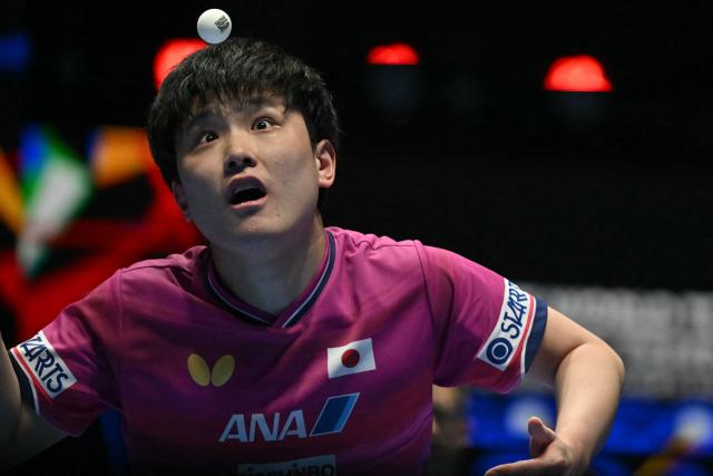 Japan's Tomokazu Harimoto serves to Taiwan's Lin Yun-ju during their Men's Teams semi-final match at the ITTF World Table Tennis Championships in Wembley Arena, west London on May 9, 2026. (Photo by Glyn KIRK / AFP)