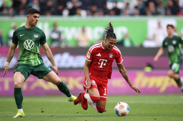 Bayern Munich's French midfielder #17 Michael Olise (R) is fouled by Wolfsburg's Greek defender #04 Konstantinos Koulierakis during the German first division Bundesliga football match between VfL Wolfsburg and FC Bayern Munich in Wolfsburg, on May 9, 2026. (Photo by Ronny HARTMANN / AFP) / DFL REGULATIONS PROHIBIT ANY USE OF PHOTOGRAPHS AS IMAGE SEQUENCES AND/OR QUASI-VIDEO