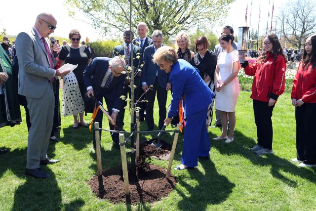 Princess Margriet of the Netherlands and her husband Pieter van Vollenhoven plant a maple tree during a visit to The Canadian Tulip Festival May 9, 2026 in Ottawa, Canada. Princess Margriet, who was born in Ottawa during World War II, is visiting Ottawa until May 11. (Photo by Dave Chan / AFP)