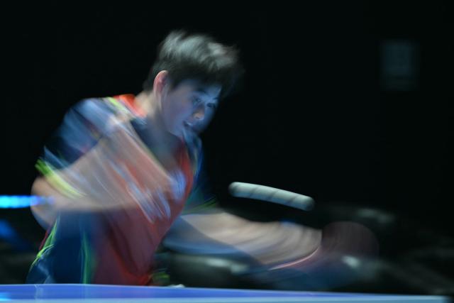 Taiwan's Kuo Guan-Hong returns to Japan's Shunsuke Togami during their Men's Teams semi-final match at the ITTF World Table Tennis Championships in Wembley Arena, west London on May 9, 2026. (Photo by Glyn KIRK / AFP)