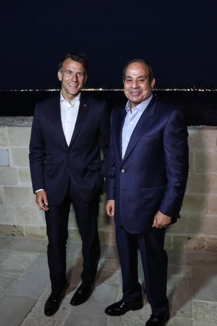 France's President Emmanuel Macron (L) and his Egyptian counterpart Abdel Fattah al-Sisi  visit the Citadel of Qaitbay in Alexandria on May 9, 2026. Macron on May 9 embarked on a visit to Africa aimed at renewing France's engagement with the continent after years of strained ties with former French speaking colonies, also travelling to Egypt, Ethiopia and Kenya. (Photo by Ludovic MARIN / AFP)