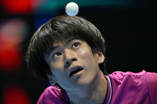 Japan's Shunsuke Togami serves to Taiwan's Kuo Guan-Hong during their Men's Teams semi-final match at the ITTF World Table Tennis Championships in Wembley Arena, west London on May 9, 2026. (Photo by Glyn KIRK / AFP)