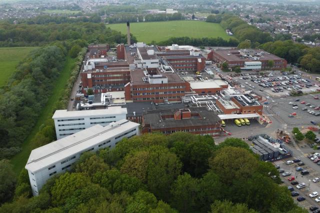 An overhead view shows Arrowe Park Hospital, where British nationals set to be repatriated after contracting hantavirus aboard an Atlantic expedition cruise ship are set to be quarantined, in Wirral, north west England on May 9, 2026. Repatriation flights for passengers aboard the cruise ship MV Hondius, hit by a deadly hantavirus outbreak are already planned to the United States, Britain, France and other countries, Spain's interior minister announced on on May 9,2026. The British passengers will have to isolate for 45 days once they return to the UK, and will be closely monitored and tested by the agency. (Photo by Annabel Lee-Ellis / AFP)