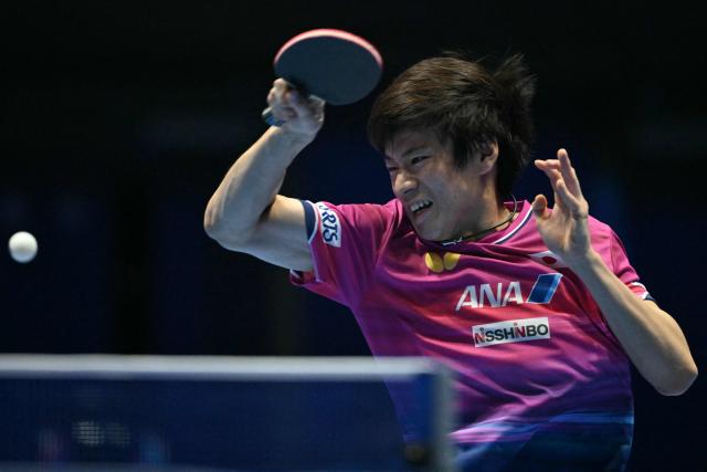 Japan's Shunsuke Togami returns to Taiwan's Kuo Guan-Hong during their Men's Teams semi-final match at the ITTF World Table Tennis Championships in Wembley Arena, west London on May 9, 2026. (Photo by Glyn KIRK / AFP)