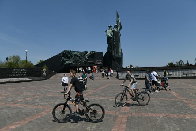People visit the Leninist Komsomol Park during celebrations of the Victory Day in Donetsk, Russian-controlled Ukraine, on May 9, 2026, amid the ongoing Russian-Ukrainian conflict. (Photo by AFP)