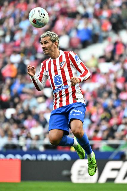 Atletico Madrid's French forward #07 Antoine Griezmann heads the ball during the Spanish league football match between Club Atletico de Madrid and RC Celta de Vigo at the Metropolitano Stadium in Madrid on May 9, 2026. (Photo by Javier SORIANO / AFP)