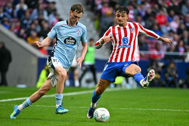 Celta Vigo's Swedish forward #19 Williot Swedberg (L) vies for the ball with Atletico Madrid's Spanish defender #18 Marc Pubill during the Spanish league football match between Club Atletico de Madrid and RC Celta de Vigo at the Metropolitano Stadium in Madrid on May 9, 2026. (Photo by Javier SORIANO / AFP)