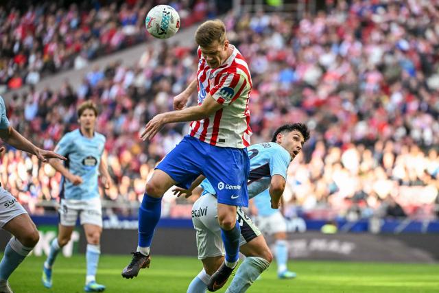Atletico Madrid's Norwegian forward #09 Alexander Sorloth heads the ball challenged by Celta Vigo's Spanish midfielder #29 Yoel Lago during the Spanish league football match between Club Atletico de Madrid and RC Celta de Vigo at the Metropolitano Stadium in Madrid on May 9, 2026. (Photo by Javier SORIANO / AFP)