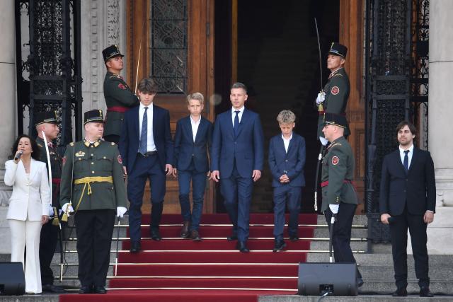 Hungary's incoming Prime Minister Peter Magyar (C) and his sons leave the parliament after his swearing-in ceremony in Budapest on May 9, 2026. Lawmakers in Hungary on May 9, 2026 swore in pro-European conservative Peter Magyar as the country's new prime minister, after elections last month that ended Viktor Orban's 16 years in power. The parliament formally elected Magyar with 140 votes for, 54 against, and one abstention in the inaugural session of the new chamber resulting from the April polls. (Photo by Ferenc ISZA / AFP)