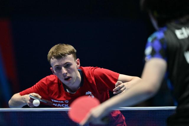 France's Flavien Coton returns to China's Wang Chuqin during their Men's Teams semi-final match at the ITTF World Table Tennis Championships in Wembley Arena, west London on May 9, 2026. (Photo by Glyn KIRK / AFP)
