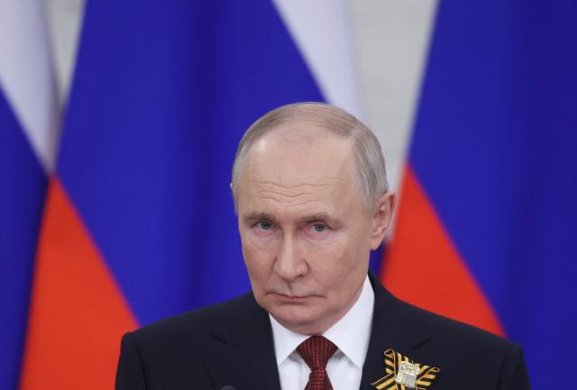 Russian President Vladimir Putin talks to the media following his meetings with foreign delegations at the Kremlin in Moscow on May 9, 2026. (Photo by MAXIM SHIPENKOV / POOL / AFP)