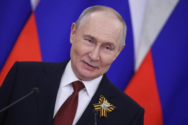 Russian President Vladimir Putin talks to the media following his meetings with foreign delegations at the Kremlin in Moscow on May 9, 2026. (Photo by MAXIM SHIPENKOV / POOL / AFP)