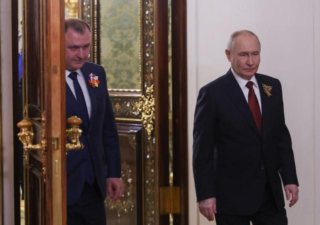Russian President Vladimir Putin and the leader of the breakaway Georgian region of South Ossetia Alan Gagloev attend a meeting at the Kremlin in Moscow on May 9, 2026. (Photo by MAXIM SHIPENKOV / POOL / AFP)