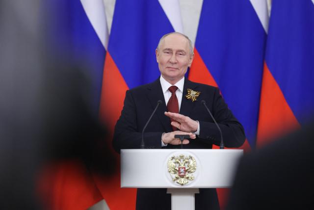 Russian President Vladimir Putin talks to the media following his meetings with foreign delegations at the Kremlin in Moscow on May 9, 2026. (Photo by MAXIM SHIPENKOV / POOL / AFP)