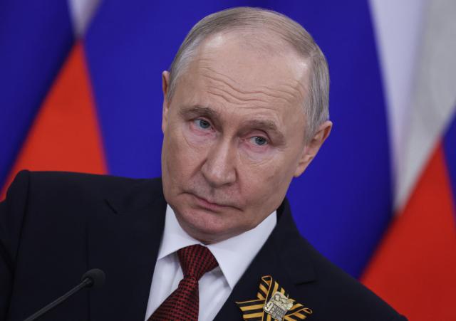 Russian President Vladimir Putin talks to the media following his meetings with foreign delegations at the Kremlin in Moscow on May 9, 2026. (Photo by MAXIM SHIPENKOV / POOL / AFP)