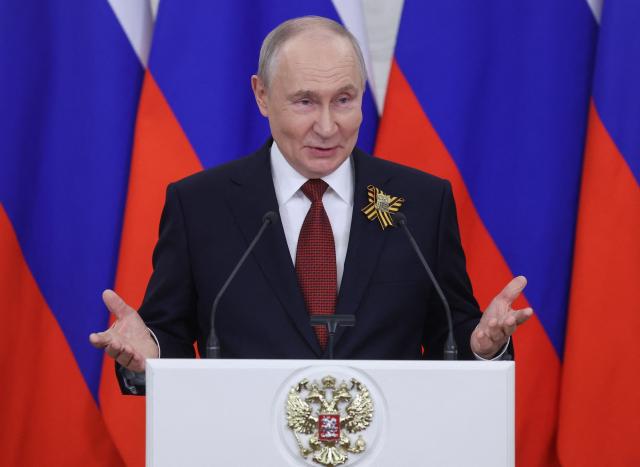 Russian President Vladimir Putin talks to the media following his meetings with foreign delegations at the Kremlin in Moscow on May 9, 2026. (Photo by MAXIM SHIPENKOV / POOL / AFP)
