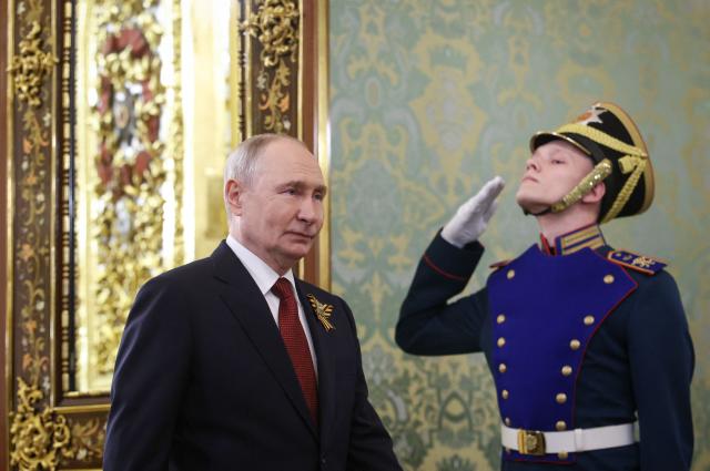 Russian President Vladimir Putin arrives for a meeting with the leader of the breakaway Georgian region of South Ossetia at the Kremlin in Moscow on May 9, 2026. (Photo by MAXIM SHIPENKOV / POOL / AFP)