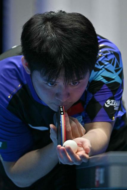 China's Lin Shidong serves to France's Felix Lebrun during their Men's Teams semi-final match at the ITTF World Table Tennis Championships in Wembley Arena, west London on May 9, 2026. (Photo by Glyn KIRK / AFP)