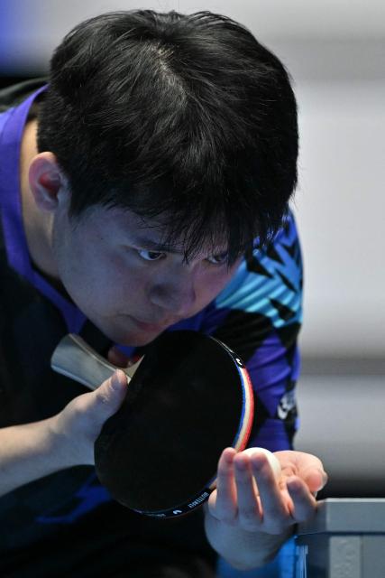 China's Lin Shidong serves to France's Felix Lebrun during their Men's Teams semi-final match at the ITTF World Table Tennis Championships in Wembley Arena, west London on May 9, 2026. (Photo by Glyn KIRK / AFP)